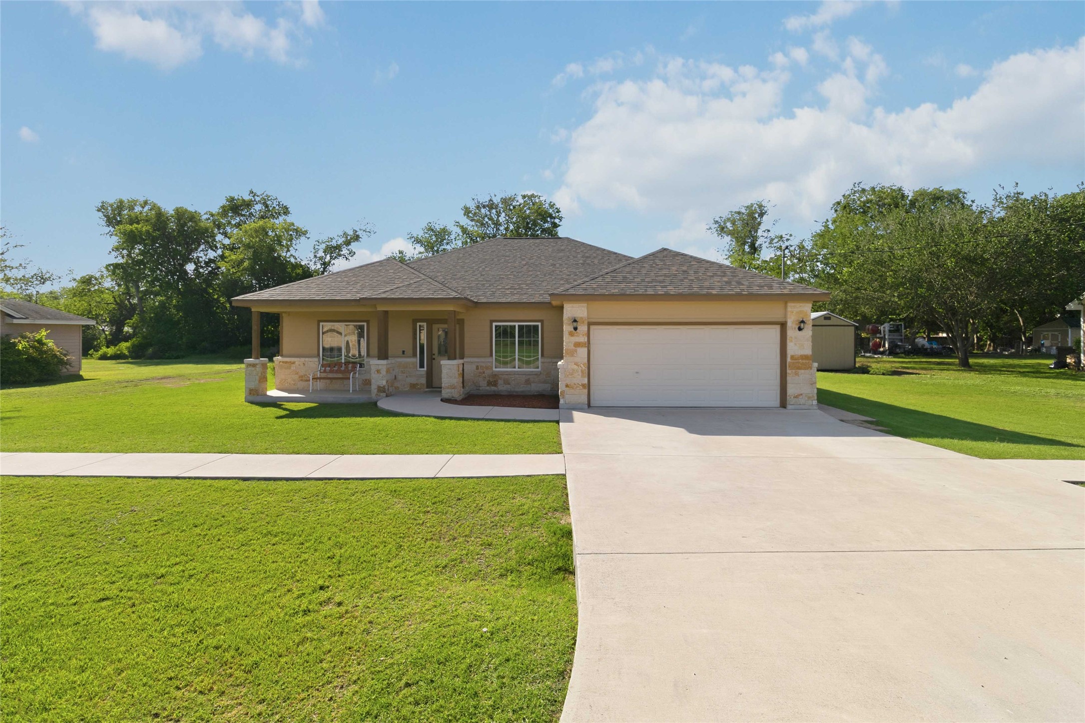 285 Hummingbird Way Martindale, TX 78655 - Photo 37 of 40 a front view of a house with garden