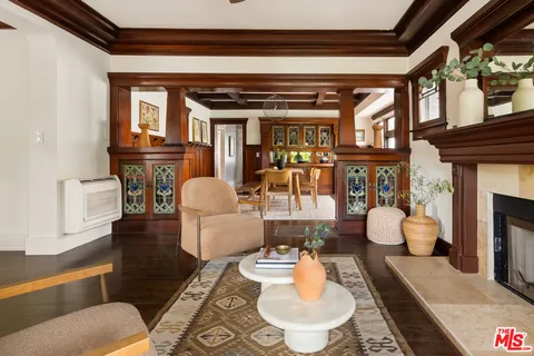 a living room with fireplace furniture and a fireplace