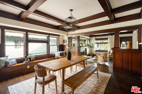 a outdoor dining space with furniture and window