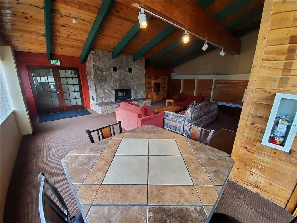 10000 Ryan Gulch Road, Unit 105 Wildernest, CO 80498 - Photo 18 of 24 a balcony with furniture