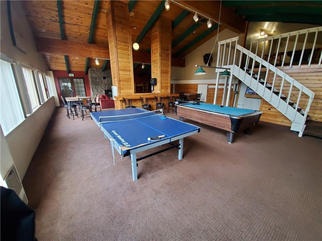 10000 Ryan Gulch Road, Unit 105 Wildernest, CO 80498 - Photo 19 of 24 a living room with furniture pool table and windows