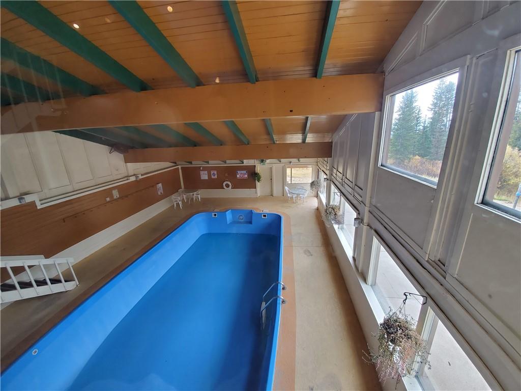 10000 Ryan Gulch Road, Unit 105 Wildernest, CO 80498 - Photo 20 of 24 a view of a balcony with chairs