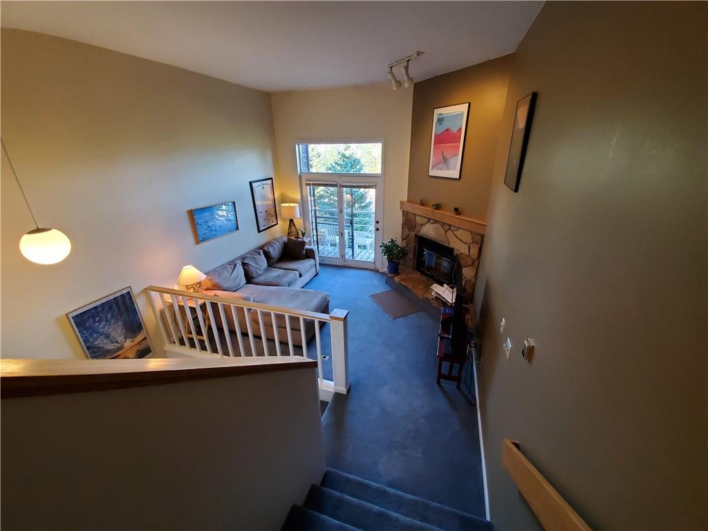 10000 Ryan Gulch Road, Unit 105 Wildernest, CO 80498 - Photo 5 of 24 a view of living room with furniture and a fireplace