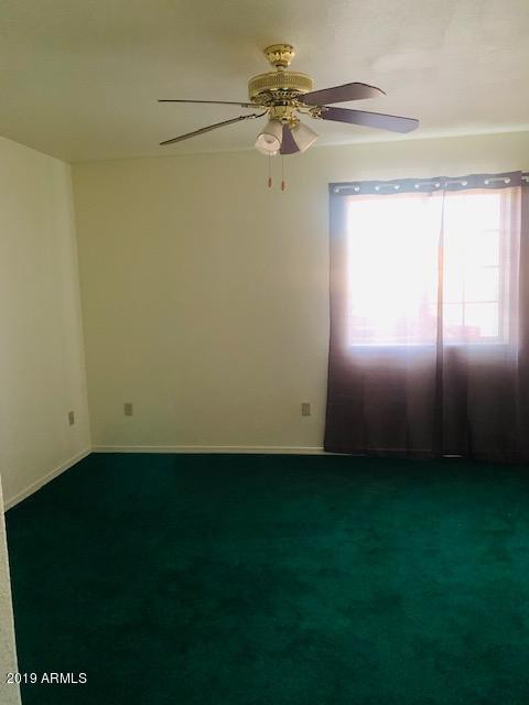 704 Elizabeth Avenue Douglas, AZ 85607 - Photo 9 of 10 a view of an empty room with a window