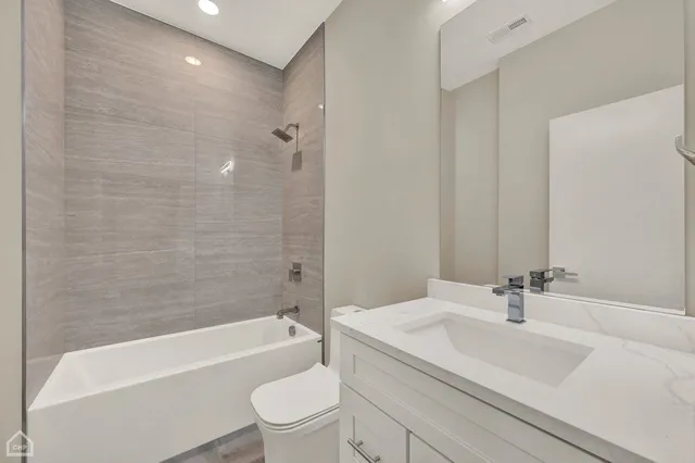 a bathroom with a sink a toilet and a bathtub