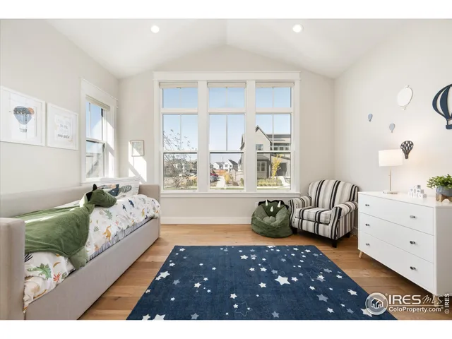 a bedroom with furniture and a bed