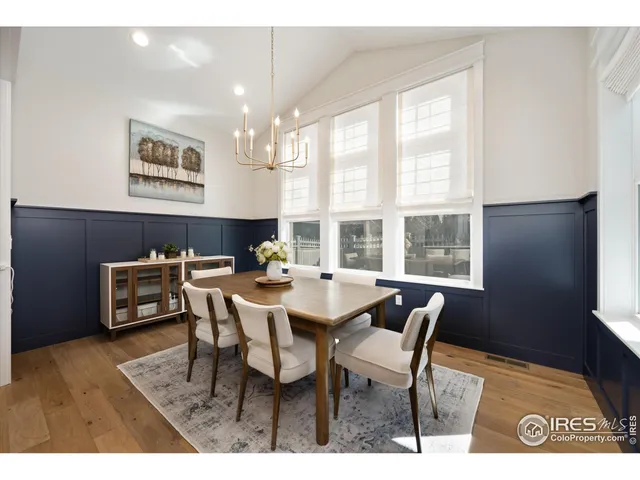 a view of a dining room with furniture and a window