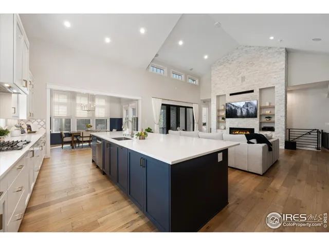 a large kitchen with stainless steel appliances lots of counter top space
