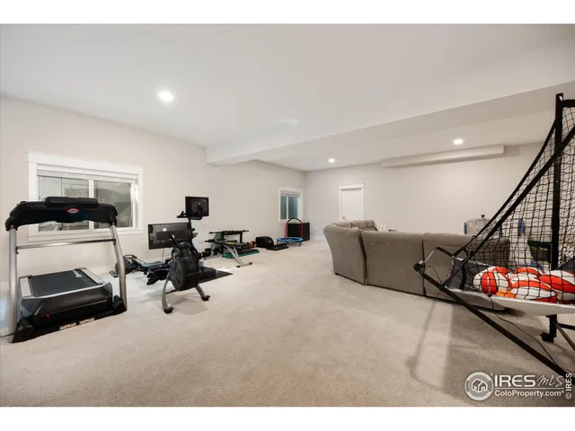 a living room with furniture gym equipment and a view of living room