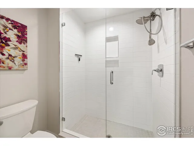 a bathroom with a shower toilet and sink