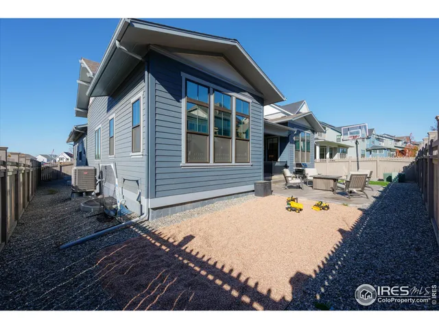 a view of house with swimming pool outdoor seating