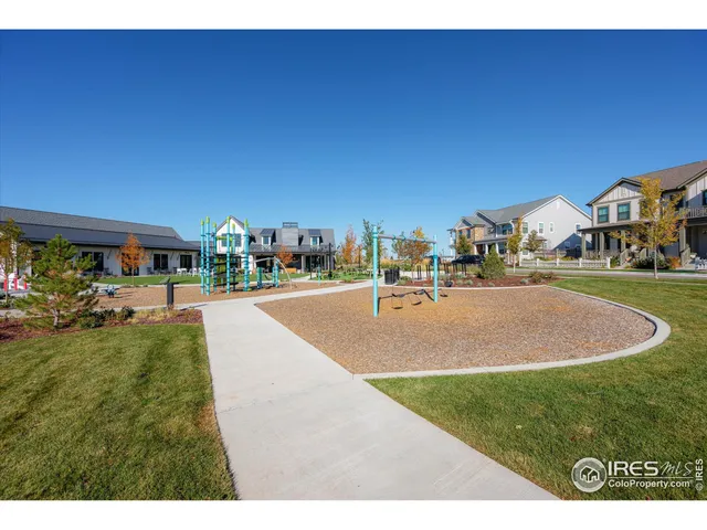 a swimming pool with outdoor seating and yard