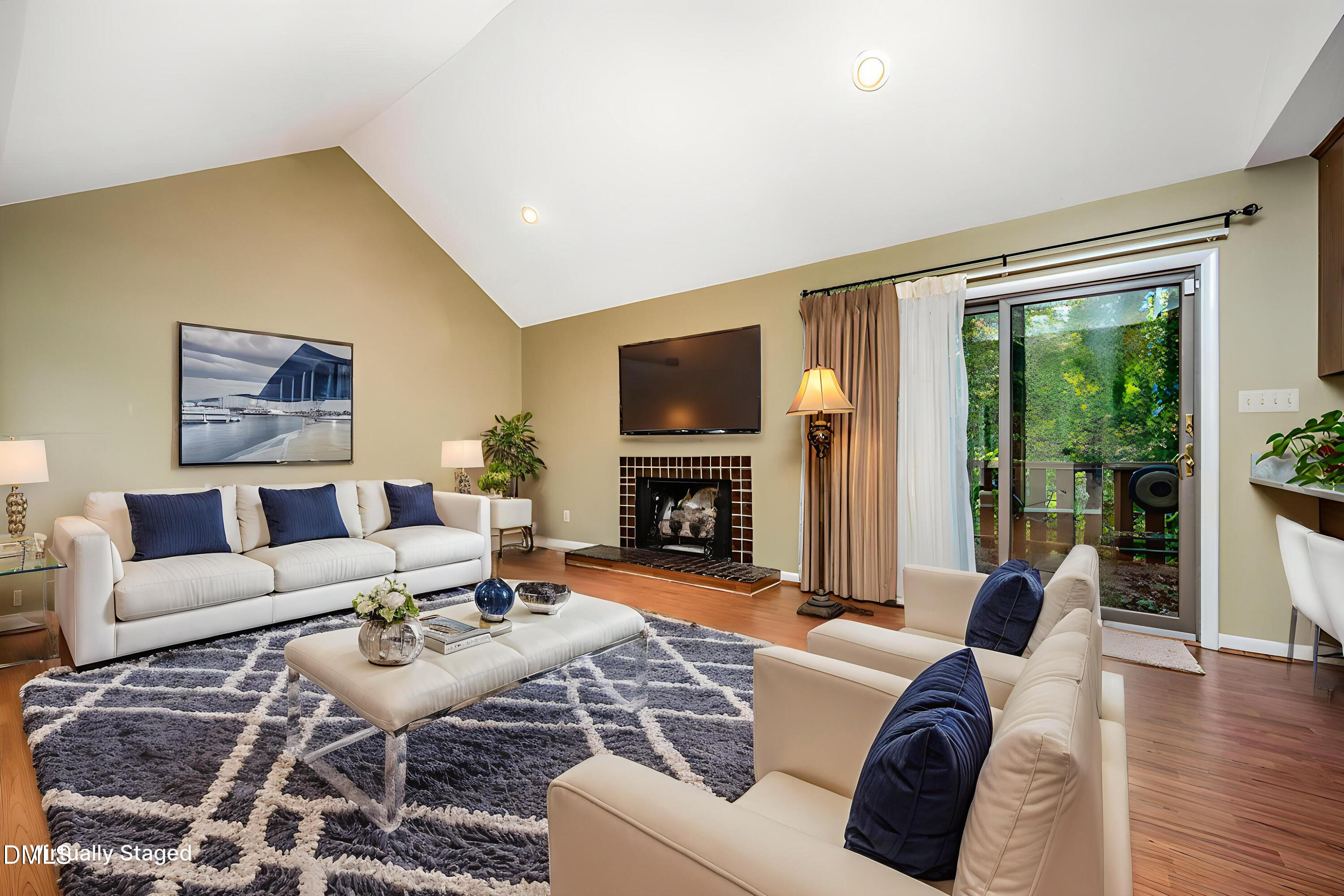 2900 Sylvania Drive Raleigh, NC 27607 - Photo 1 of 36 a living room with furniture a large window and a fireplace