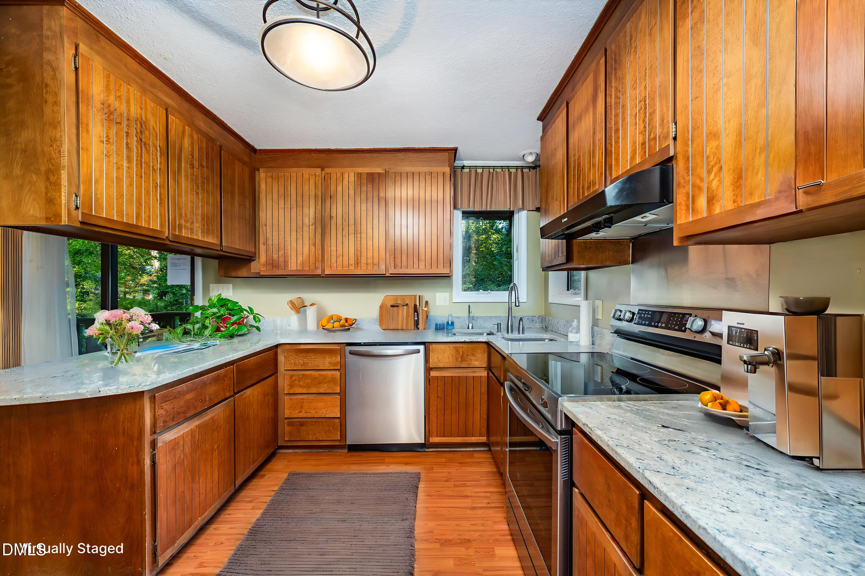 2900 Sylvania Drive Raleigh, NC 27607 - Photo 21 of 49 a kitchen with stainless steel appliances granite countertop a stove a sink and a refrigerator