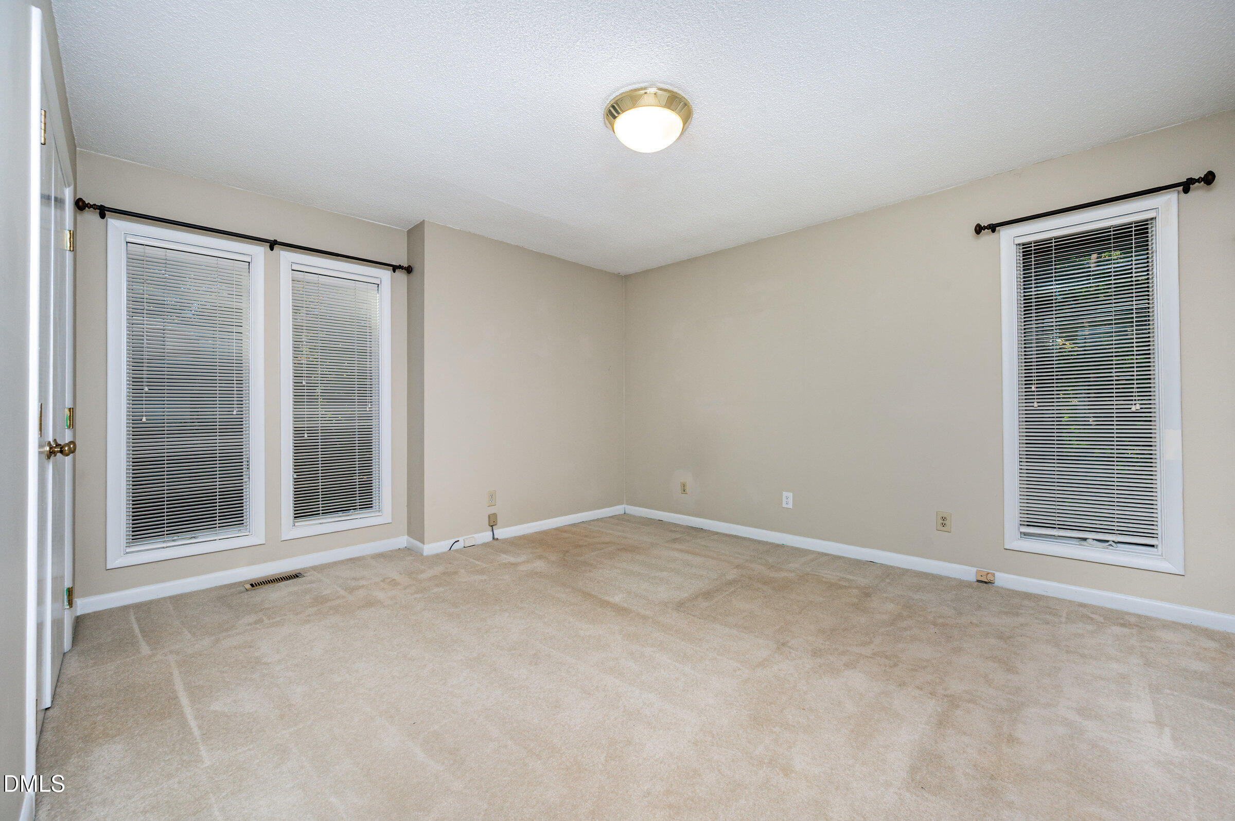 2900 Sylvania Drive Raleigh, NC 27607 - Photo 22 of 36 an empty room with windows and closet