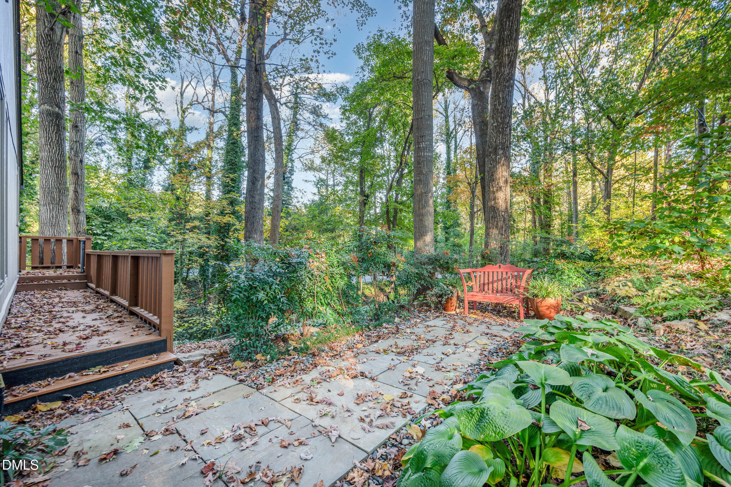 2900 Sylvania Drive Raleigh, NC 27607 - Photo 30 of 36 a wooden bench in a garden