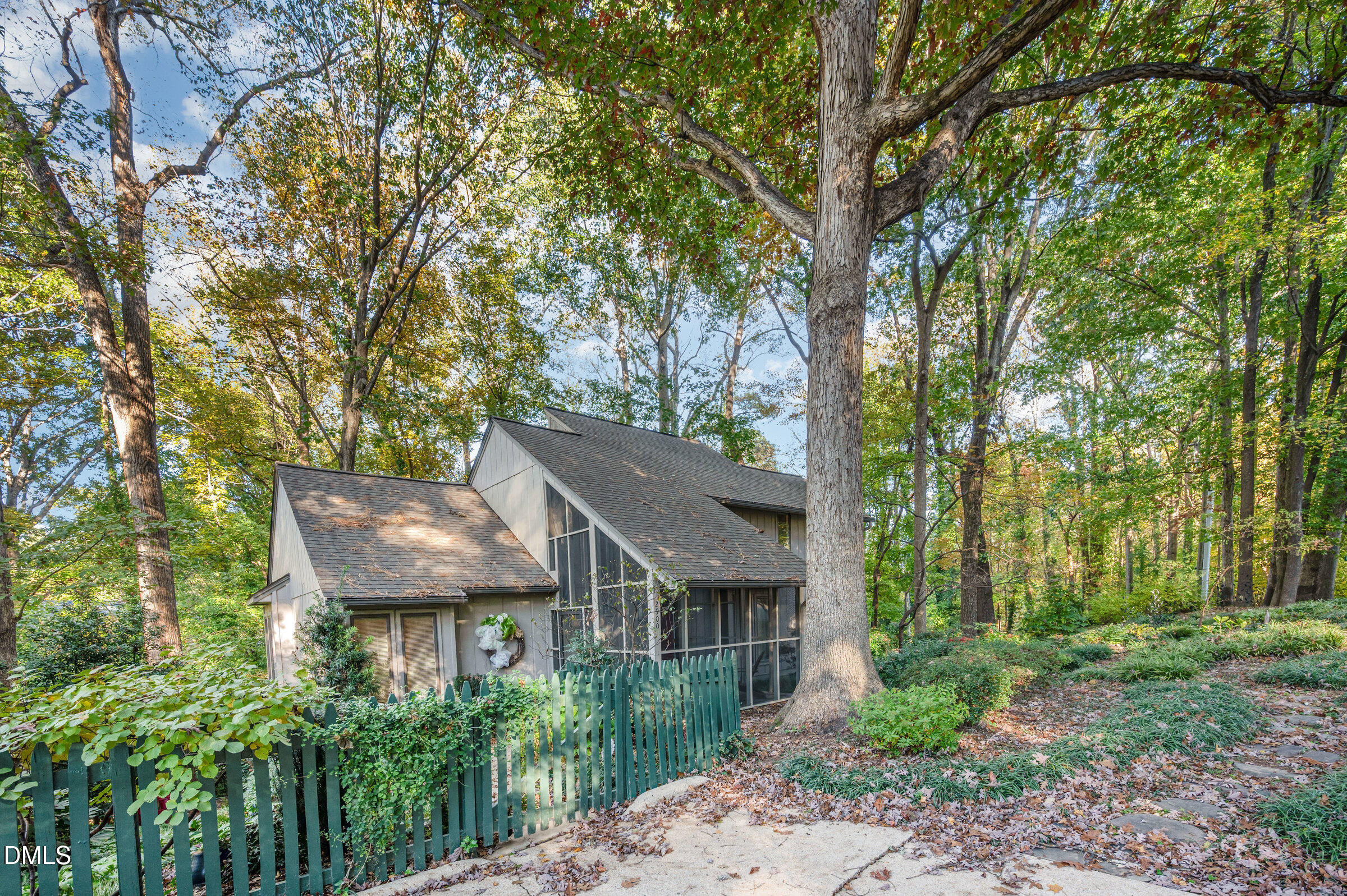 2900 Sylvania Drive Raleigh, NC 27607 - Photo 4 of 36 a house with trees in front of it