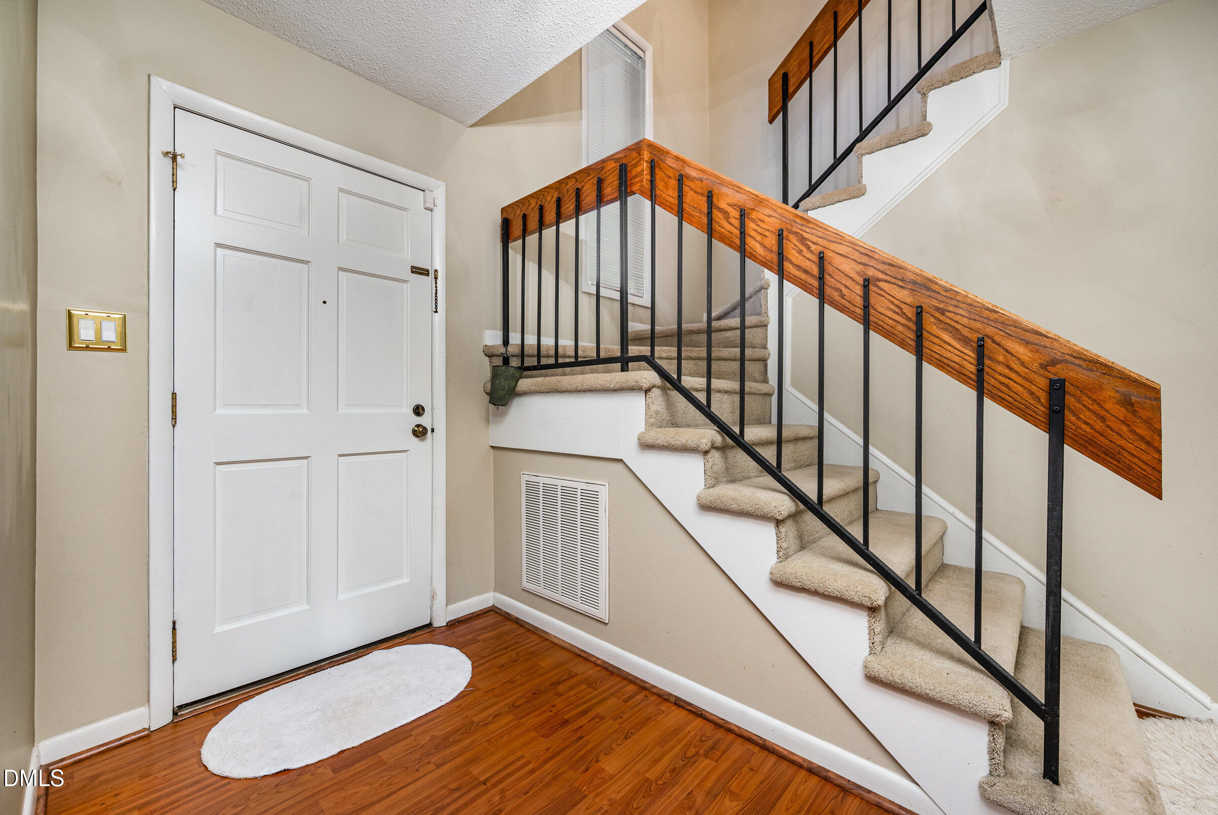 2900 Sylvania Drive Raleigh, NC 27607 - Photo 5 of 36 a view of entryway with wooden floor