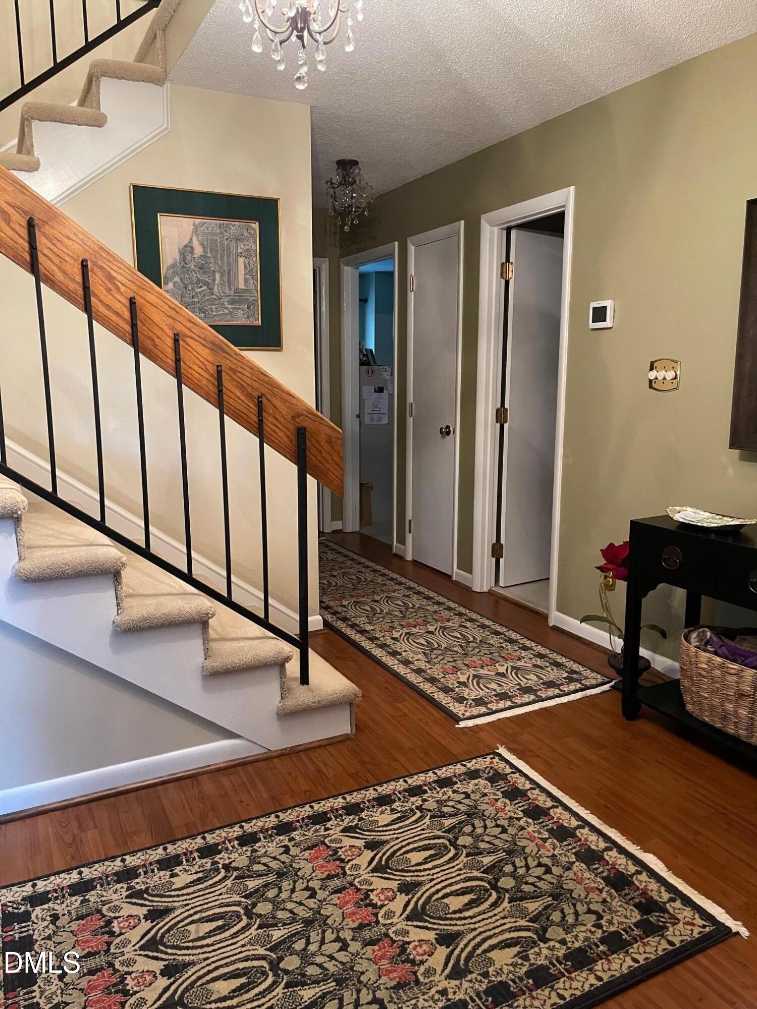 2900 Sylvania Drive Raleigh, NC 27607 - Photo 7 of 49 a view of an entryway with wooden floor