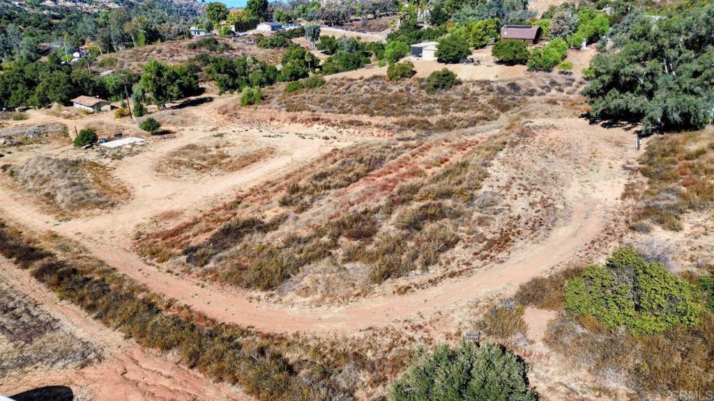 29851 Lilac Road Valley Center, CA 92082 - Photo 26 of 48 a view of a dry yard covered with snow in the background