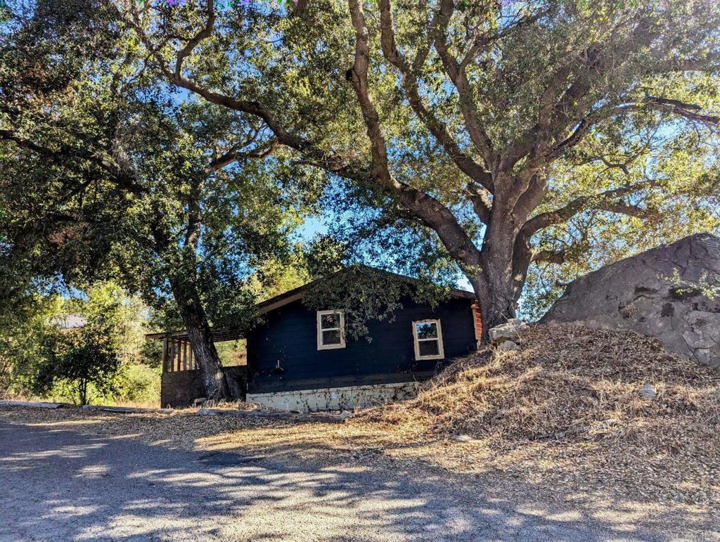 29851 Lilac Road Valley Center, CA 92082 - Photo 36 of 48 a front view of a house with a yard and garage