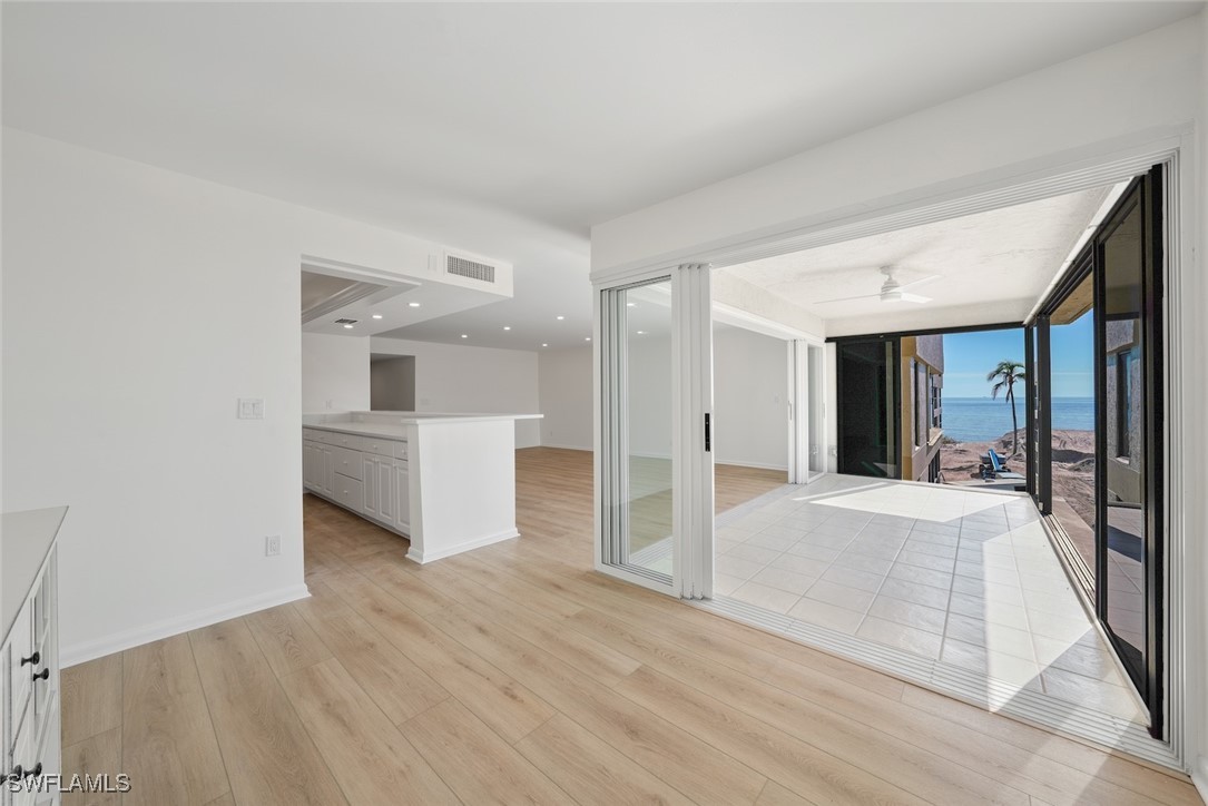 Undisclosed Address Sanibel, FL 33957 - Photo 16 of 30 a view of a big room with wooden floor and windows