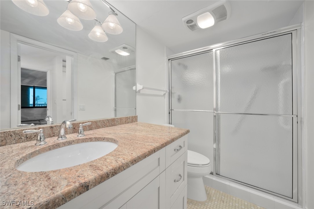 Undisclosed Address Sanibel, FL 33957 - Photo 22 of 30 a bathroom with a granite countertop sink toilet and shower