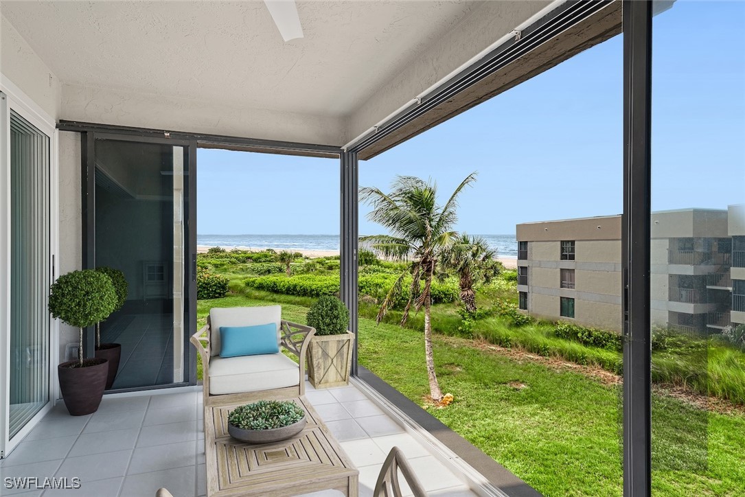 Undisclosed Address Sanibel, FL 33957 - Photo 5 of 30 a view of a balcony with chair potted plants