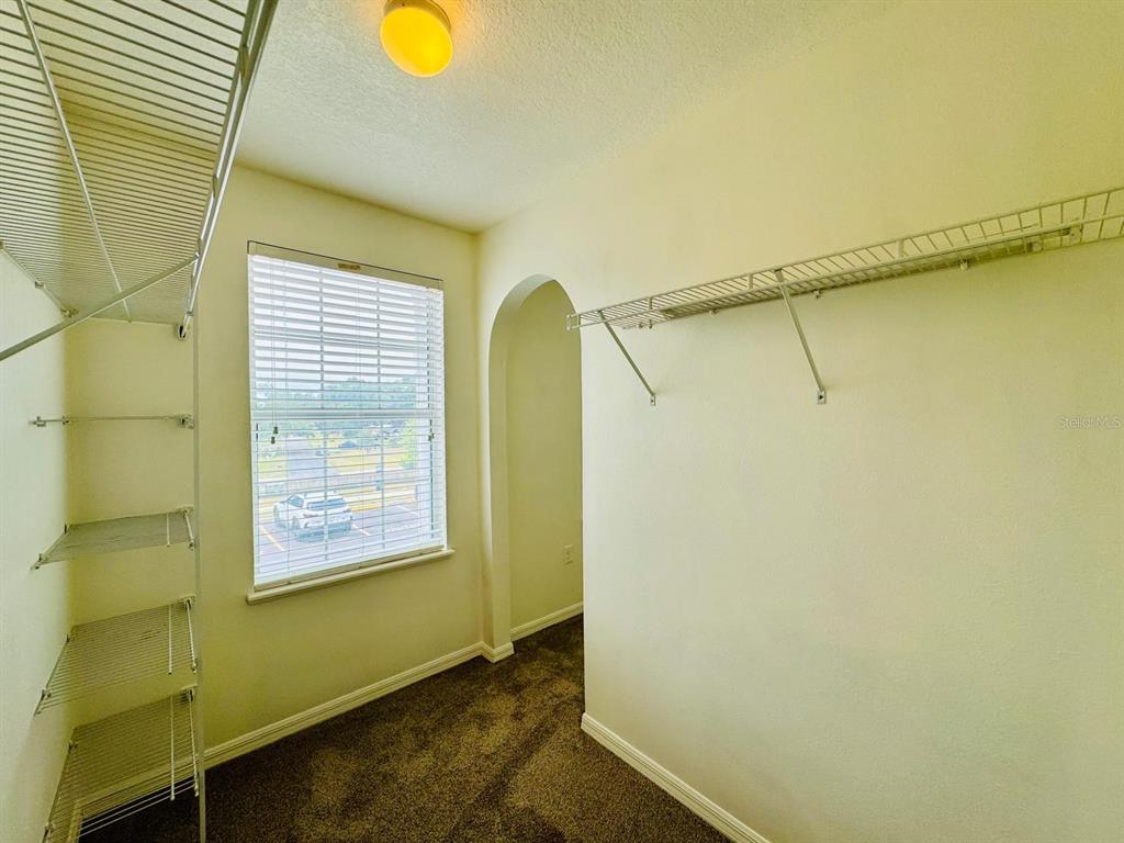 4518 Ashburn Square Drive Tampa, FL 33610 - Photo 15 of 34 a view of walk in closet with window
