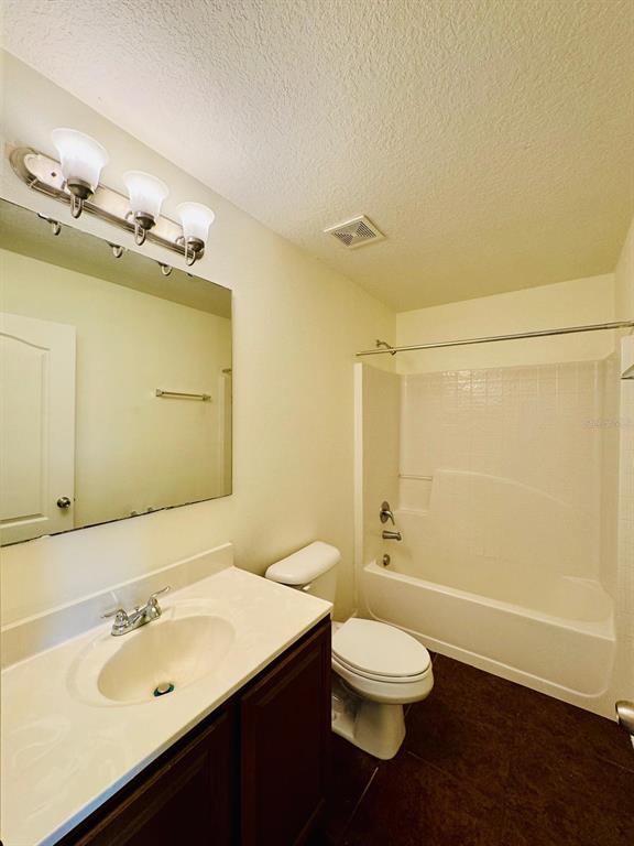 4518 Ashburn Square Drive Tampa, FL 33610 - Photo 20 of 34 a bathroom with a sink a toilet and shower