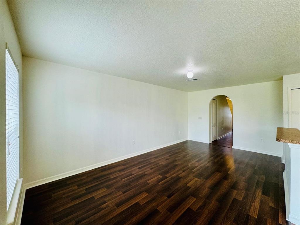 4518 Ashburn Square Drive Tampa, FL 33610 - Photo 25 of 34 a view of empty room with wooden floor