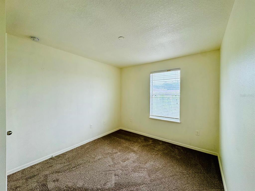 4518 Ashburn Square Drive Tampa, FL 33610 - Photo 8 of 34 an empty room with a window