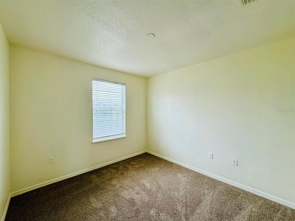 4518 Ashburn Square Drive Tampa, FL 33610 - Photo 9 of 34 an empty room with a window