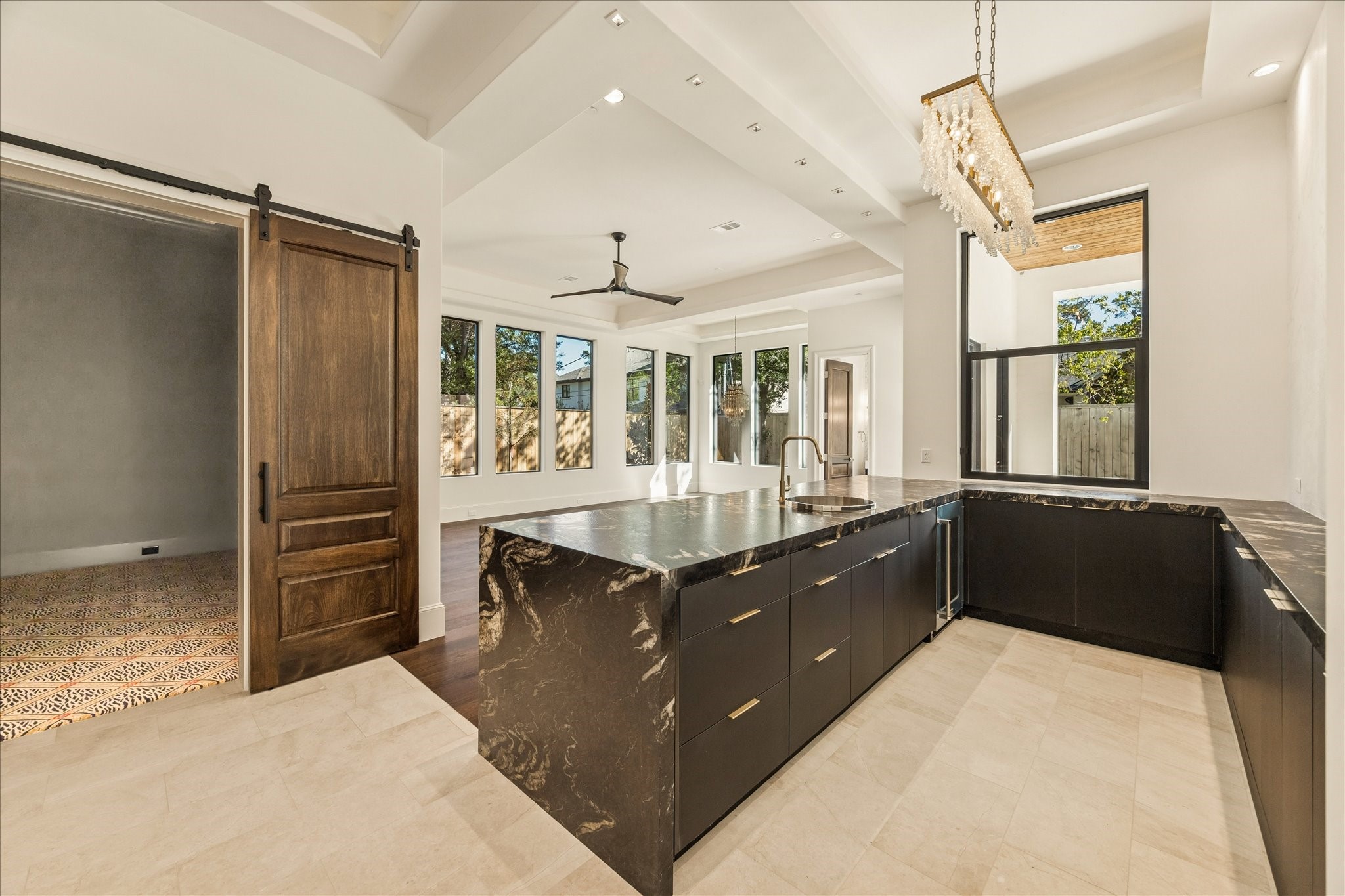 318 Knipp Road Houston, TX 77024 - Photo 13 of 44 a kitchen with granite countertop a refrigerator and a sink
