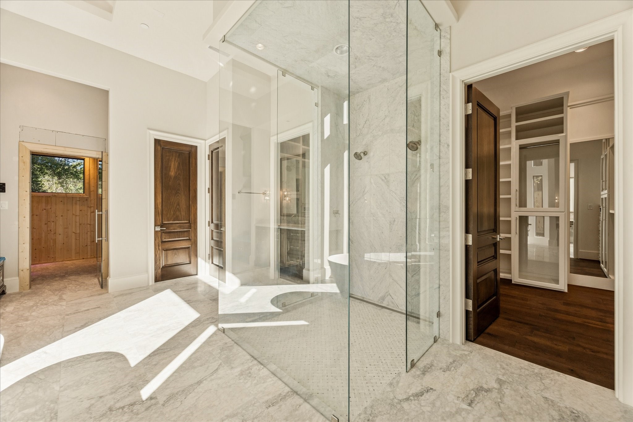 318 Knipp Road Houston, TX 77024 - Photo 19 of 44 a spacious bedroom with a bed and a walk in closet