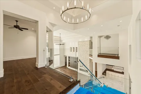 a very nice looking room with wooden floor and staircase