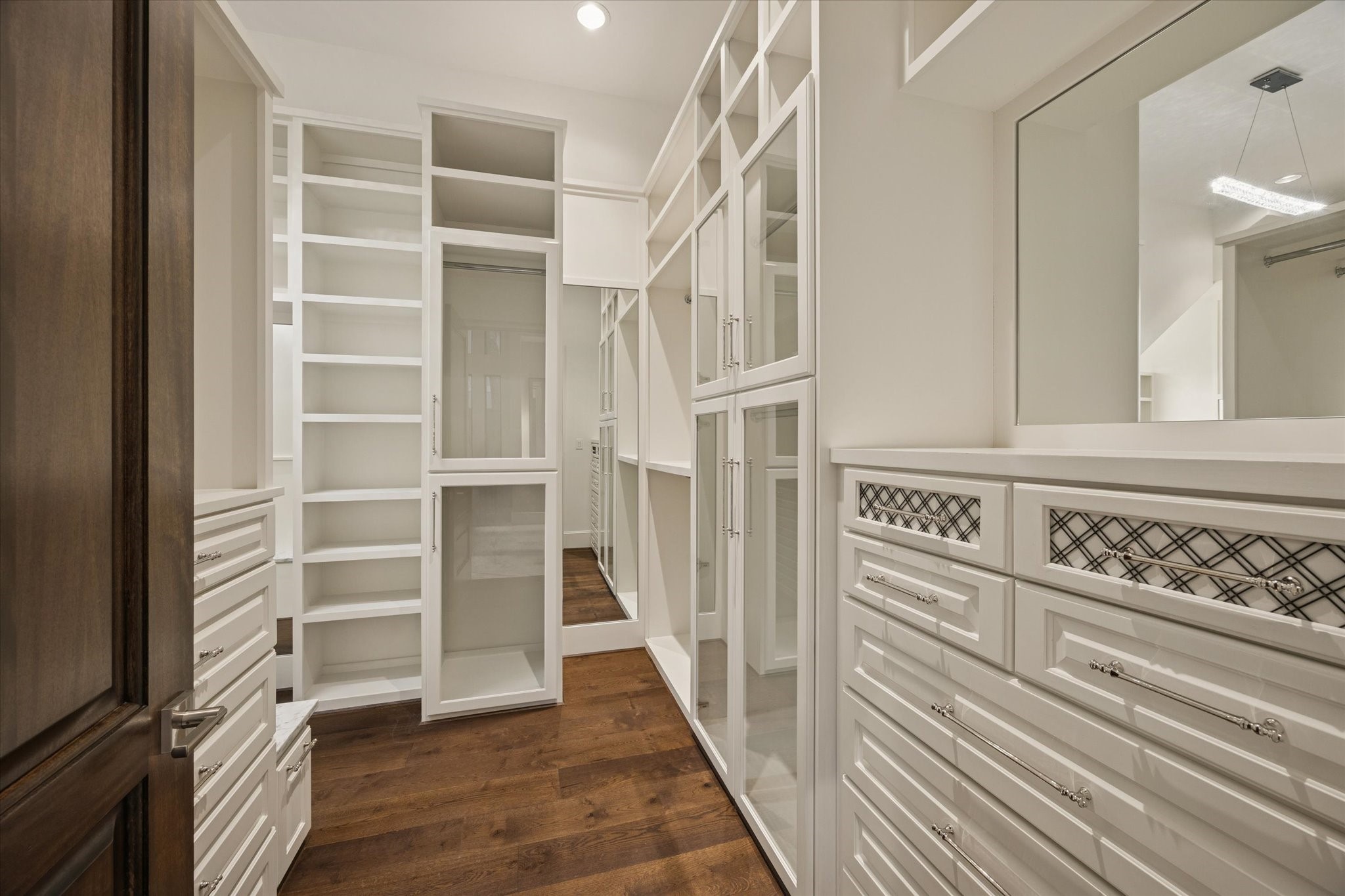 318 Knipp Road Houston, TX 77024 - Photo 25 of 48 a view of staircase with white walls and wooden floor