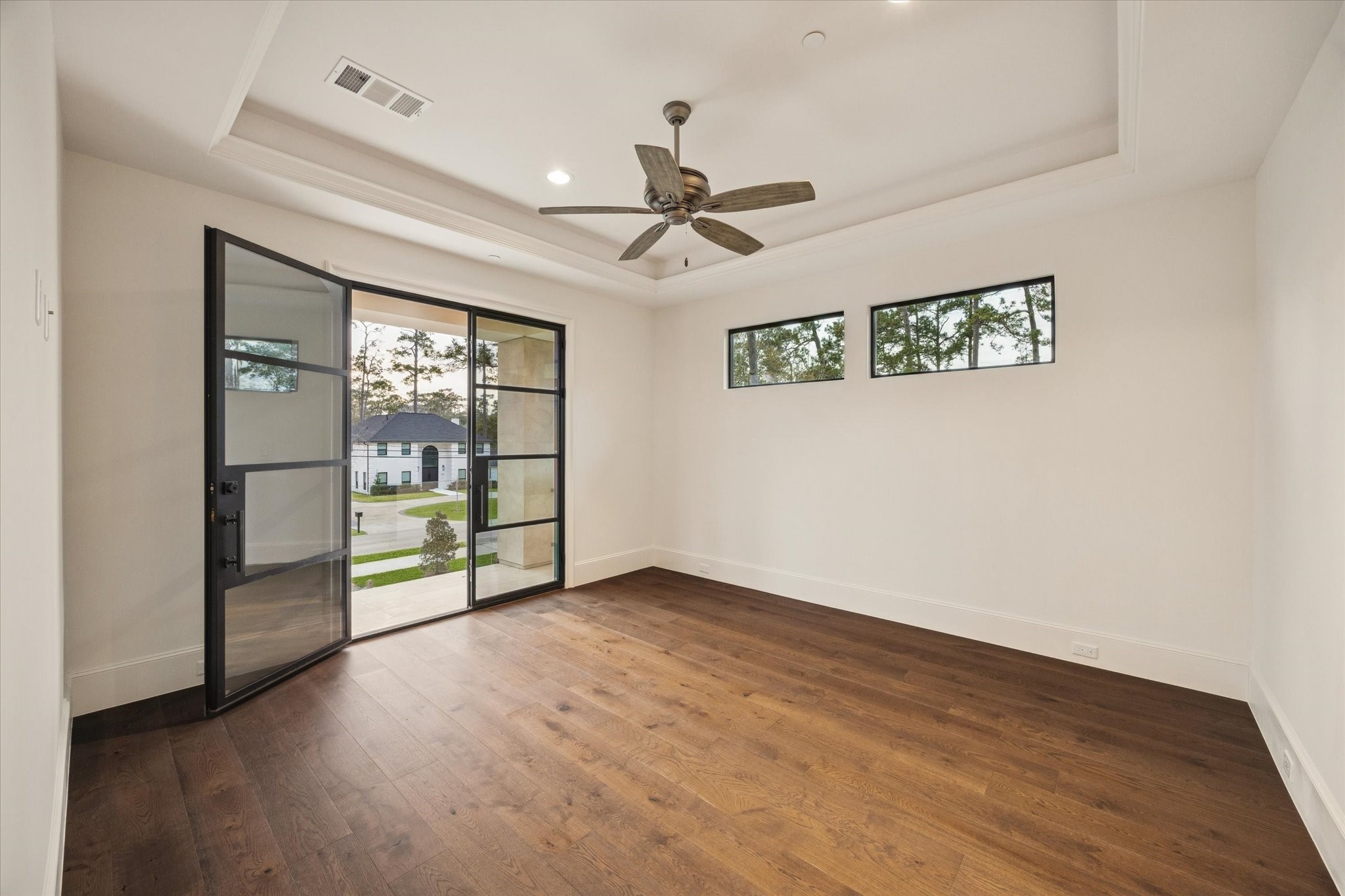 318 Knipp Road Houston, TX 77024 - Photo 28 of 48 wooden floor in an empty room with a window