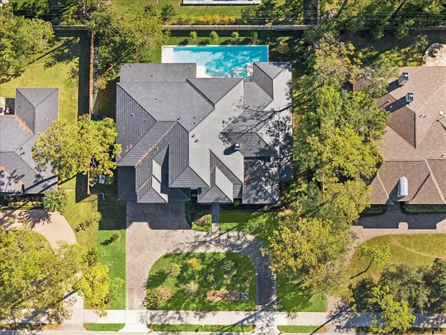 a aerial view of a house with a yard and garden