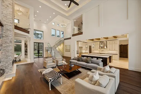 a living room with furniture ceiling fan and a rug