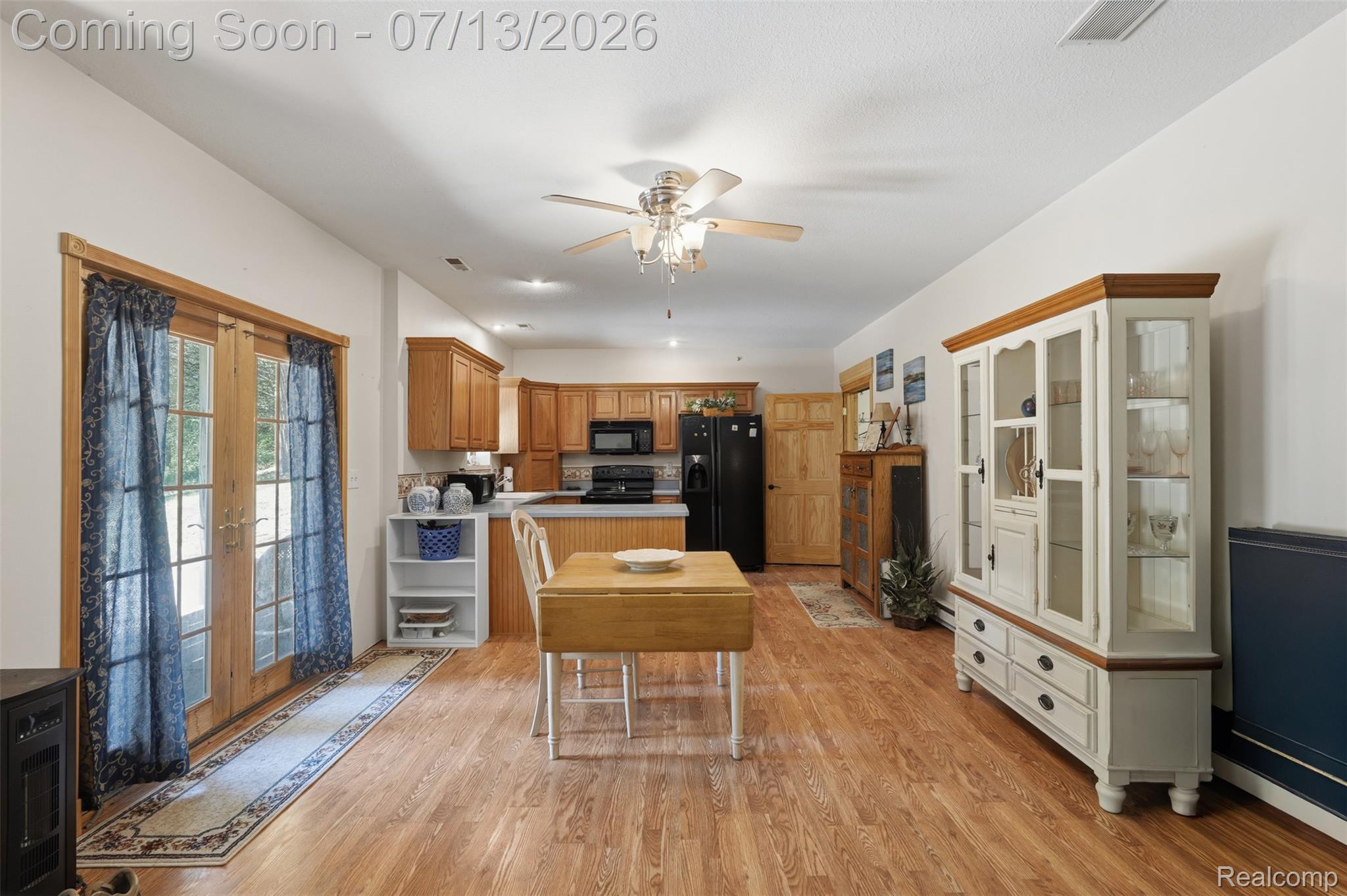 10525 Antcliff Road Brooklyn, MI 49230 - Photo 34 of 80 Open-concept lower level living space featuring a fireplace with views of nature