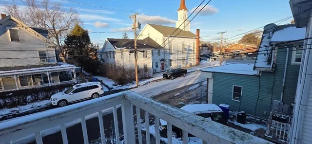 a view of a house with backyard and deck