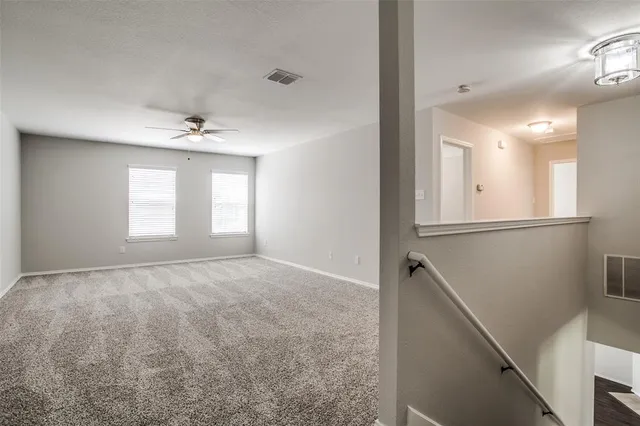 a view of an empty room and a windows