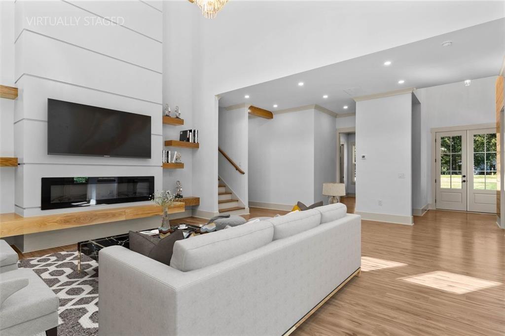 1960 Lost Mountain Road Powder Springs, GA 30127 - Photo 16 of 56 a living room with fireplace furniture and a flat screen tv