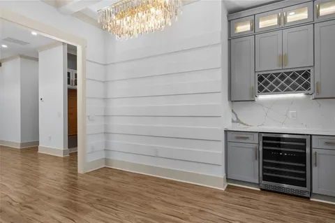 a kitchen with stainless steel appliances a stove a sink and a refrigerator
