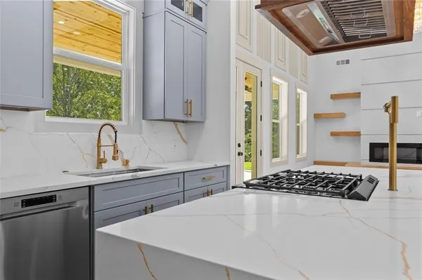 a spacious bathroom with a sink a mirror and shower