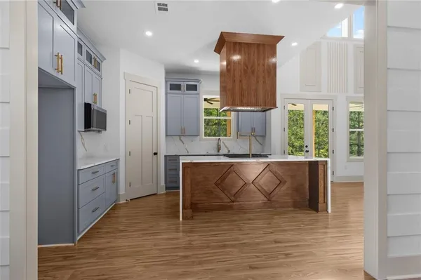 a kitchen with a sink a stove and a refrigerator