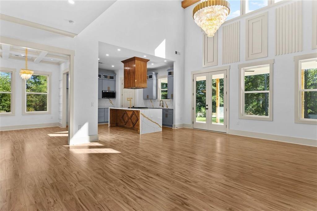 1960 Lost Mountain Road Powder Springs, GA 30127 - Photo 29 of 56 an empty room with wooden floor and windows