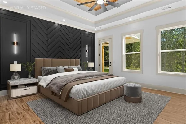 a en suite bathroom with a granite countertop sink and a mirror
