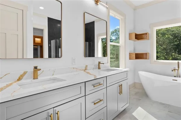 a view of a livingroom with a ceiling fan wooden floor and a window